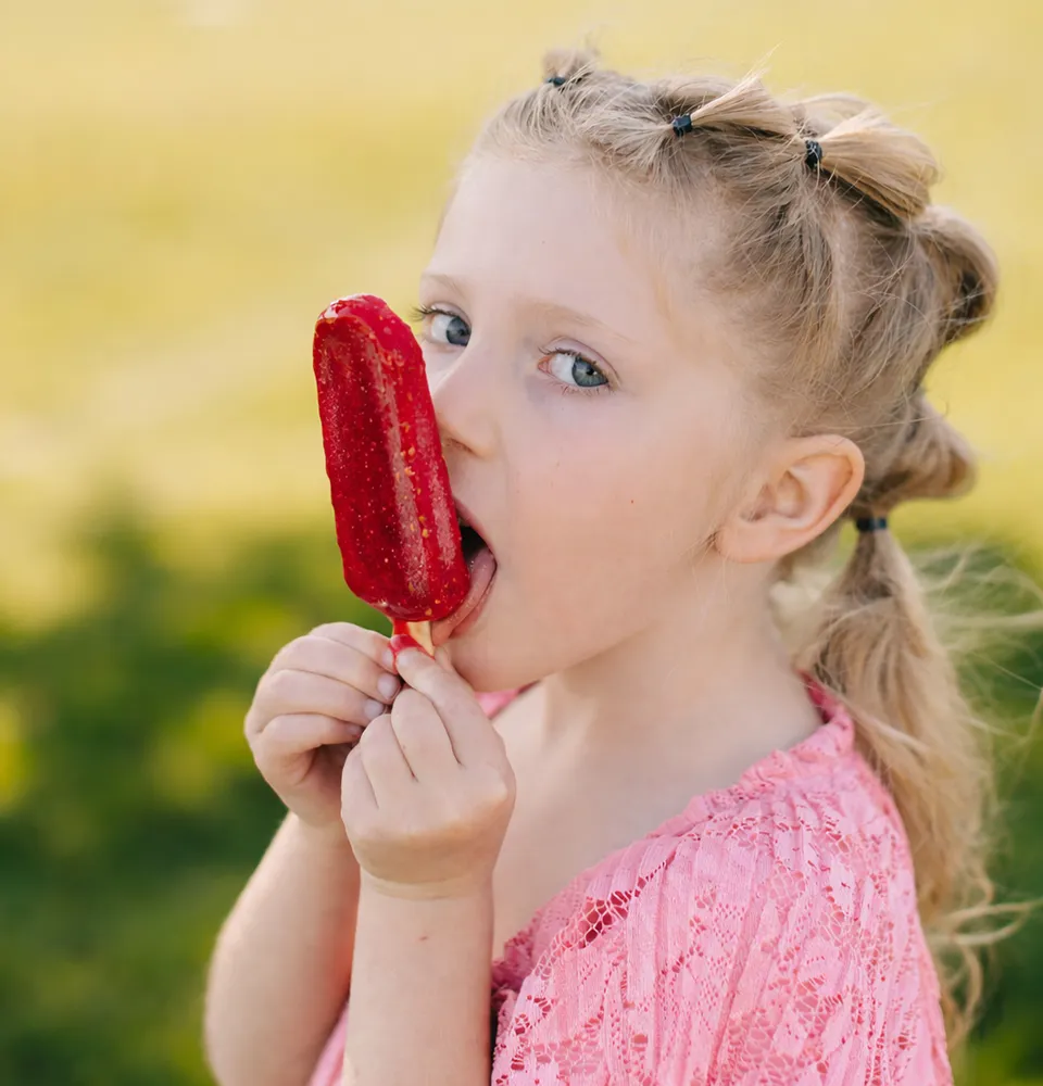 Papa and Nana's grandchild with raspberry pop
